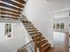 Elegant staircase featuring hardwood treads and iron railings at 584 Indian Hills Pkwy, Marietta, GA 30068