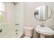 Simple bathroom with white sink, toilet and combined tub and shower at 946 Crew Sw St, Atlanta, GA 30315