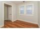 Comfortable room with laminate flooring, neutral walls and natural light from two windows at 946 Crew Sw St, Atlanta, GA 30315