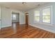 A bright living room featuring hardwood floors and many windows for natural light at 946 Crew Sw St, Atlanta, GA 30315