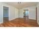 An open living room featuring hardwood floors and ample access to other rooms at 946 Crew Sw St, Atlanta, GA 30315