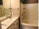 Bathroom featuring granite counters, updated fixtures, and a shower-tub combination at 1975 Hoods Fort Nw Cir # 24, Kennesaw, GA 30144