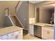 Open concept kitchen with granite countertops, stainless steel appliances, and modern fixtures at 1975 Hoods Fort Nw Cir # 24, Kennesaw, GA 30144