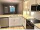 Modern kitchen featuring white cabinets, granite countertops, and stainless steel appliances at 1975 Hoods Fort Nw Cir # 24, Kennesaw, GA 30144