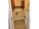Functional laundry room with wood cabinets, and an electric water heater at 1975 Hoods Fort Nw Cir # 24, Kennesaw, GA 30144