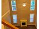 Spacious living room featuring large windows, a ceiling fan and a fireplace at 1975 Hoods Fort Nw Cir # 24, Kennesaw, GA 30144