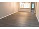 Spacious living room showcases wooden floors and views of the kitchen and backyard at 1975 Hoods Fort Nw Cir # 24, Kennesaw, GA 30144