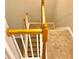 A carpeted staircase featuring decorative wood railing leads to the upper level of this home at 1975 Hoods Fort Nw Cir # 24, Kennesaw, GA 30144