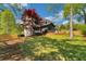 Lovely backyard with a screened porch, lush lawn, and privacy fence at 3040 Greenfield Dr, Marietta, GA 30068