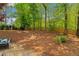 Large backyard with a wooden privacy fence and lush landscaping at 3040 Greenfield Dr, Marietta, GA 30068