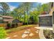 The backyard features a well-manicured lawn, privacy fence, and screened-in porch at 3040 Greenfield Dr, Marietta, GA 30068