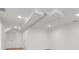 A finished basement boasts modern lighting and freshly painted walls, great for entertaining at 3040 Greenfield Dr, Marietta, GA 30068