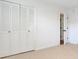 Bedroom with bi-fold closet doors and neutral carpet and walls at 3040 Greenfield Dr, Marietta, GA 30068