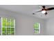 Bedroom featuring large windows with plantation shutters and neutral walls and trim at 3040 Greenfield Dr, Marietta, GA 30068