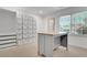 Large walk-in closet with built-in storage solutions and custom island/display at 3040 Greenfield Dr, Marietta, GA 30068