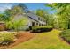 Charming two-story home with manicured landscaping, a garage, and a lush lawn at 3040 Greenfield Dr, Marietta, GA 30068