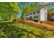 Charming two-story home with a well-manicured front yard and mature trees at 3040 Greenfield Dr, Marietta, GA 30068