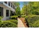 Charming home exterior featuring manicured bushes, walkway, and inviting curb appeal at 3040 Greenfield Dr, Marietta, GA 30068
