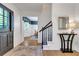 Charming foyer featuring stylish console table, staircase, and elegant decor at 3040 Greenfield Dr, Marietta, GA 30068