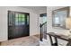 Inviting foyer with shiplap walls, stylish rug, and staircase with black railings at 3040 Greenfield Dr, Marietta, GA 30068