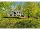 Charming two-story traditional home featuring black shutters and a lush front yard at 3040 Greenfield Dr, Marietta, GA 30068