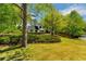 Charming home with a well-manicured front yard and mature trees at 3040 Greenfield Dr, Marietta, GA 30068