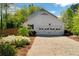Home exterior featuring a well-maintained garage, driveway, and landscaping at 3040 Greenfield Dr, Marietta, GA 30068