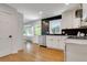 Bright kitchen with white cabinets, stainless steel appliances, and hardwood floors at 3040 Greenfield Dr, Marietta, GA 30068