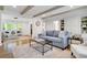 Open concept living room featuring hardwood floors, bay window and exposed beams at 3040 Greenfield Dr, Marietta, GA 30068