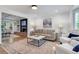 Bright living room featuring a fireplace, built-in shelves, hardwood floors, and comfortable seating at 3040 Greenfield Dr, Marietta, GA 30068
