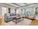 Inviting living room with hardwood floors, exposed beams, and ample natural light at 3040 Greenfield Dr, Marietta, GA 30068
