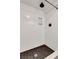 The elegant modern shower features chic subway tile and a rainfall shower head at 3040 Greenfield Dr, Marietta, GA 30068