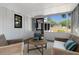 Enclosed sunroom with wicker furniture, a ceiling fan, and views of the backyard at 3040 Greenfield Dr, Marietta, GA 30068