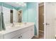 Bright bathroom features a double sink vanity with abundant counter space and a view into the next room at 629 Gold Valley Pass, Canton, GA 30114