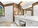 Bright bathroom features an extended vanity, large mirror, and a window offering natural light and outdoor views at 629 Gold Valley Pass, Canton, GA 30114