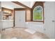 Bathroom with a tub under a window, double doors and a large vanity with a mirror at 629 Gold Valley Pass, Canton, GA 30114