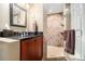 Bathroom with a granite countertop and tiled shower at 629 Gold Valley Pass, Canton, GA 30114
