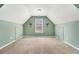 Spacious bonus room with carpet and lots of natural light from the window at 629 Gold Valley Pass, Canton, GA 30114