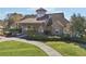 Charming clubhouse with stone accents, a well-manicured lawn, and inviting walkway at 629 Gold Valley Pass, Canton, GA 30114