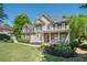 Beautifully landscaped yard and a cozy front porch highlight this home's exterior at 629 Gold Valley Pass, Canton, GA 30114