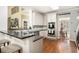 Gourmet kitchen featuring granite countertops, stainless steel appliances, and hardwood floors at 629 Gold Valley Pass, Canton, GA 30114