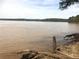 Waterfront property with a serene view of the calm lake waters, ideal for relaxation and nature enthusiasts at 629 Gold Valley Pass, Canton, GA 30114