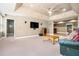 Spacious living room featuring recessed lighting, a large television, and seamless access to other living spaces at 629 Gold Valley Pass, Canton, GA 30114