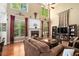 Spacious living room with a fireplace, hardwood floors, and large windows, creating a warm and inviting atmosphere at 629 Gold Valley Pass, Canton, GA 30114