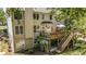 Aerial view of a backyard featuring an upper deck and lower covered patio at 629 Gold Valley Pass, Canton, GA 30114