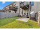 Spacious backyard with a patio area, lush green grass, and a wooden fence for added privacy at 7545 Roseberry Way, Lithonia, GA 30038