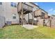 Well maintained backyard featuring lush green grass, a patio area, and a wooden fence for added privacy at 7545 Roseberry Way, Lithonia, GA 30038