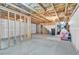Large unfinished basement featuring concrete flooring and exposed ceiling joists with open layout at 7545 Roseberry Way, Lithonia, GA 30038
