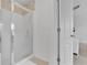 Bright bathroom featuring a glass-enclosed shower with stylish tile accents and modern fixtures at 7545 Roseberry Way, Lithonia, GA 30038