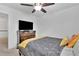Bright bedroom with ceiling fan, carpet floors and a large window at 7545 Roseberry Way, Lithonia, GA 30038